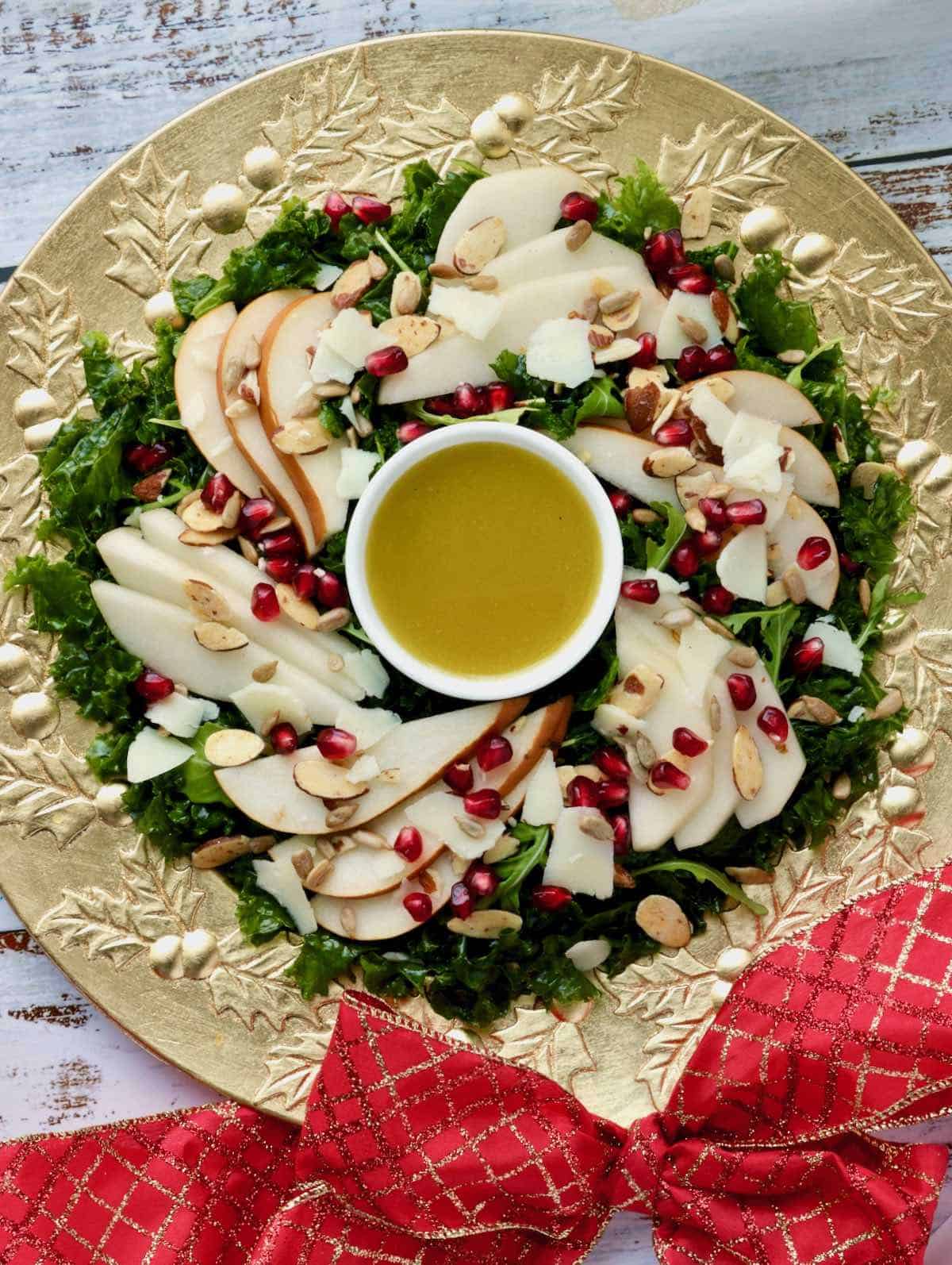 Pear salad on gold platter with red bow.