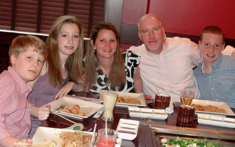 Aidan and his family having dinner.