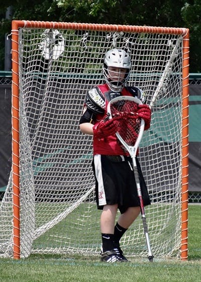 Aidan playing lacrosse.