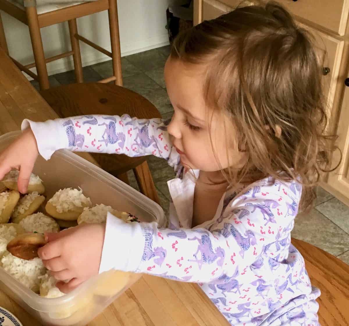 Grand daughter choosing a cookie.