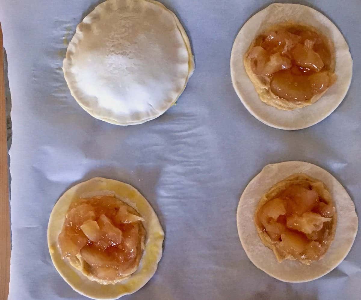 Pastry topped with almond and apple filling.