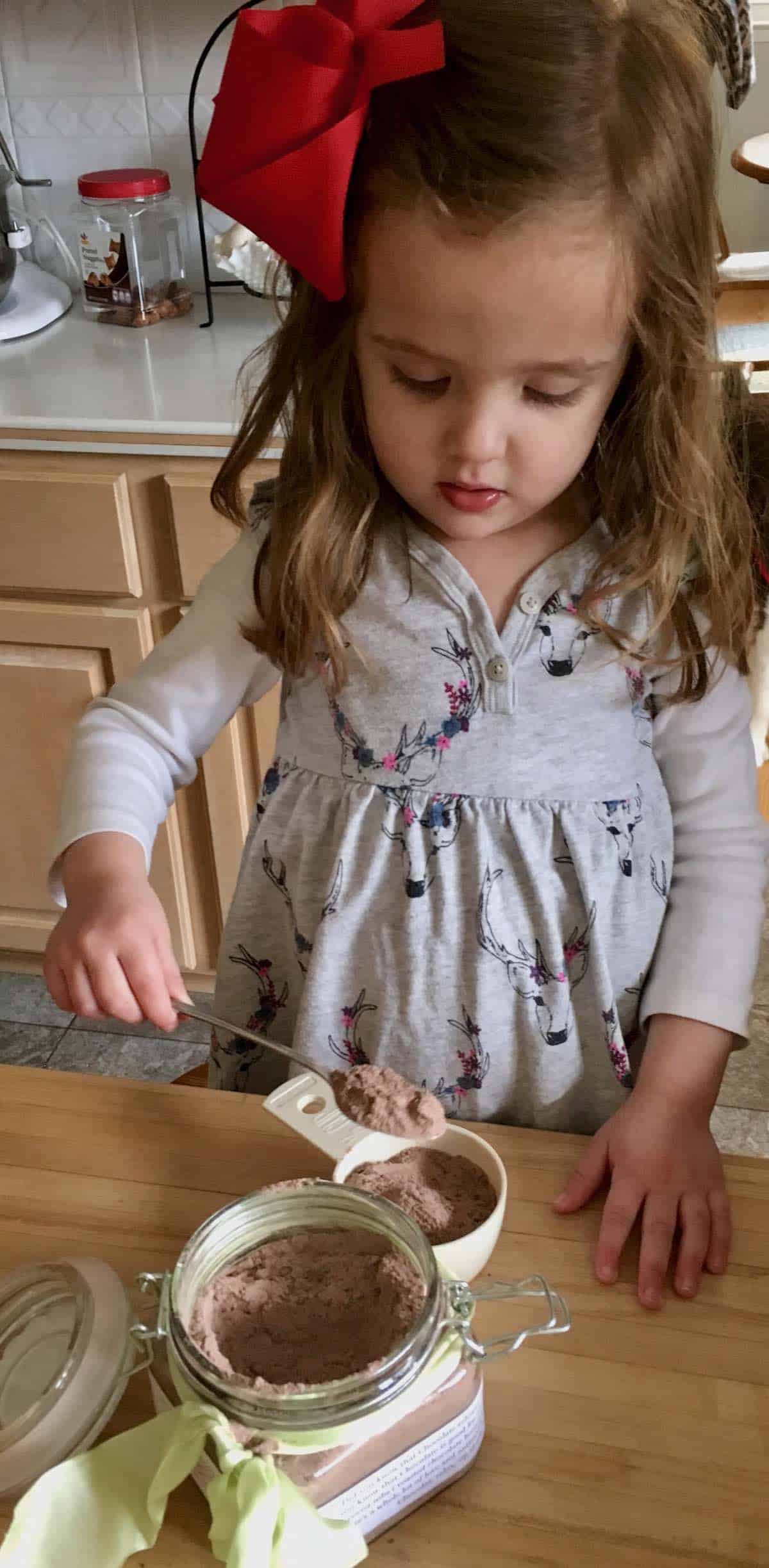 My grand daughter spooning the most decadent hot chocolate mix.