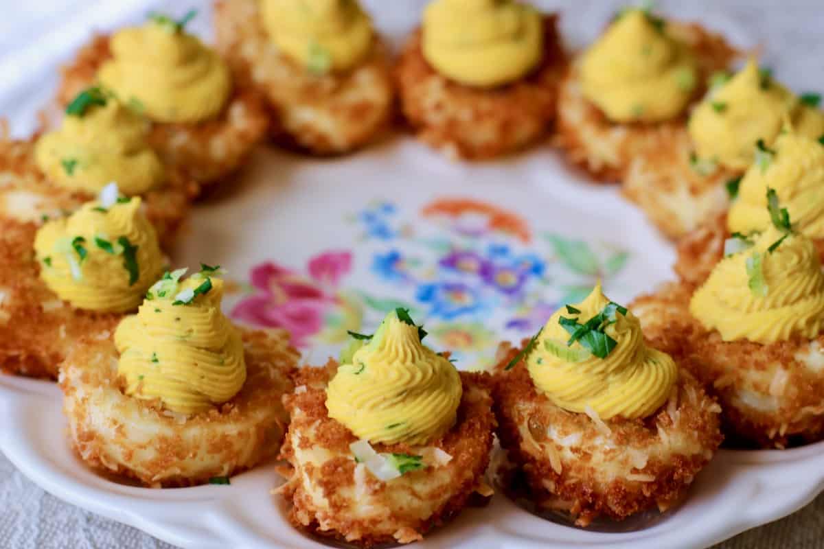 Plate of crispy coconut curried devils eggs.