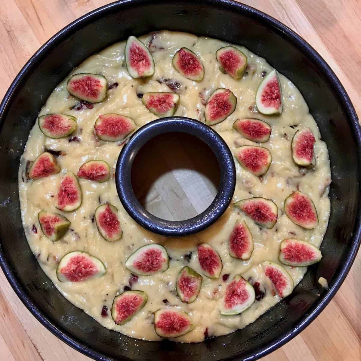 Unbaked fig cake in pan.