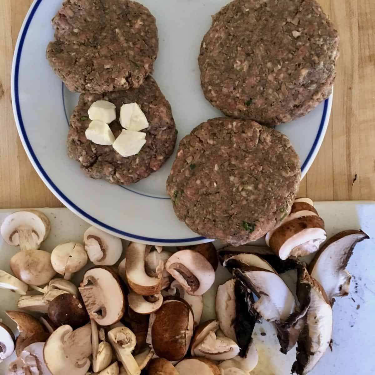 Raw burgers with cheese and blended mushrooms