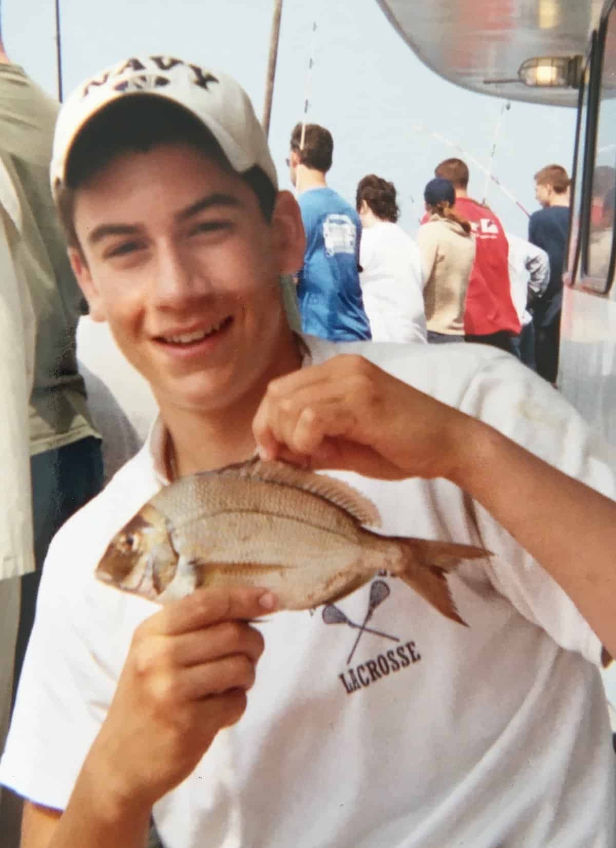 My son on fishing boat.