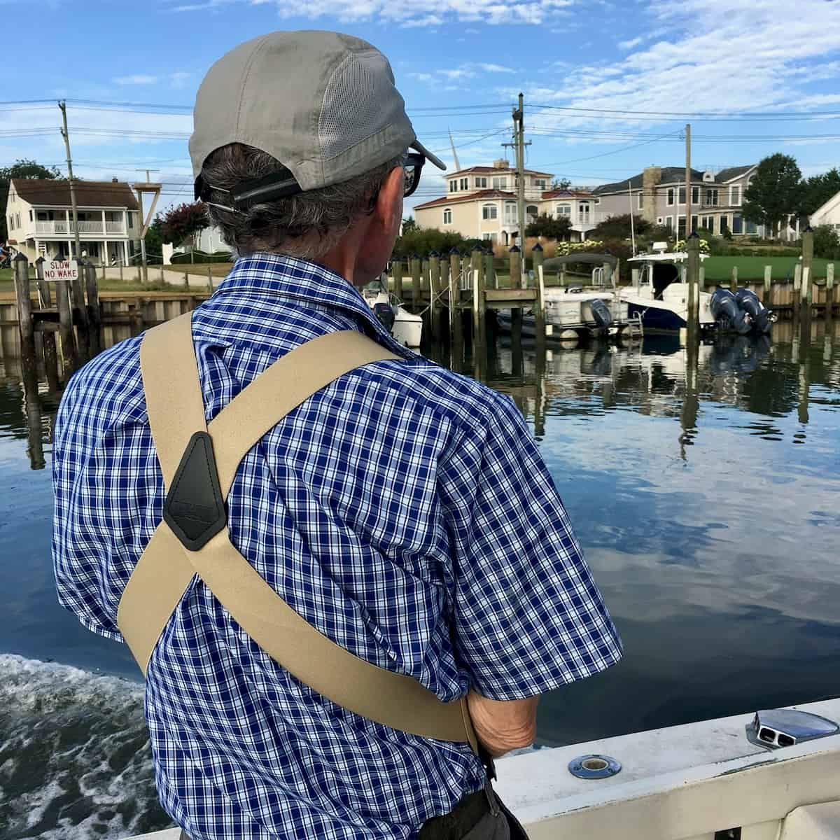 My husband on a boat off the coast of the beach house.