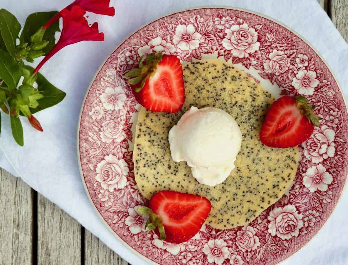 Best poppy seed cookies topped with ice cream and strawberries.