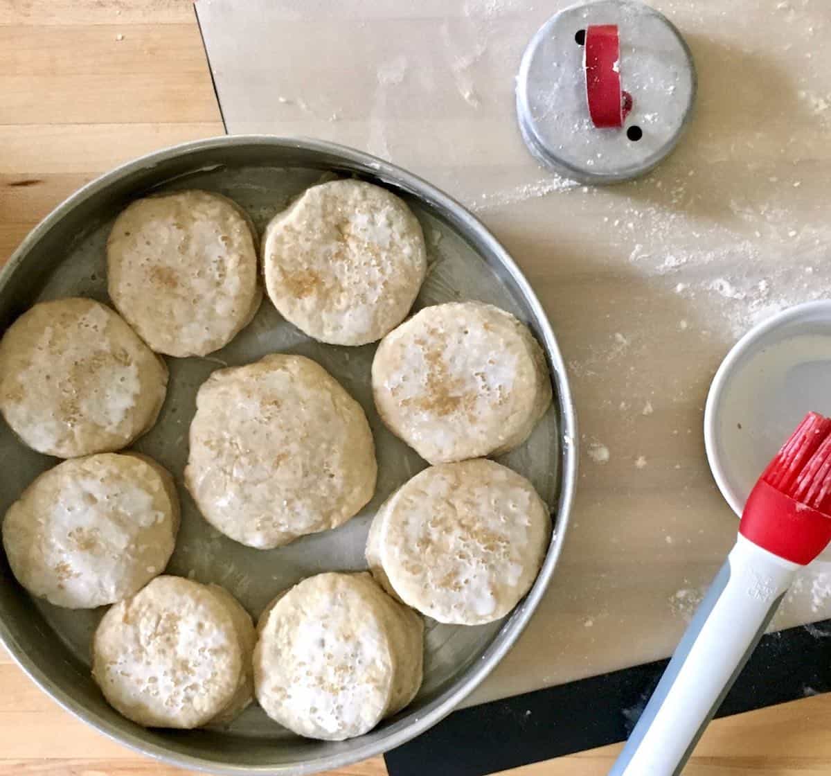 Unbaked easy apple butter biscuits in pan.