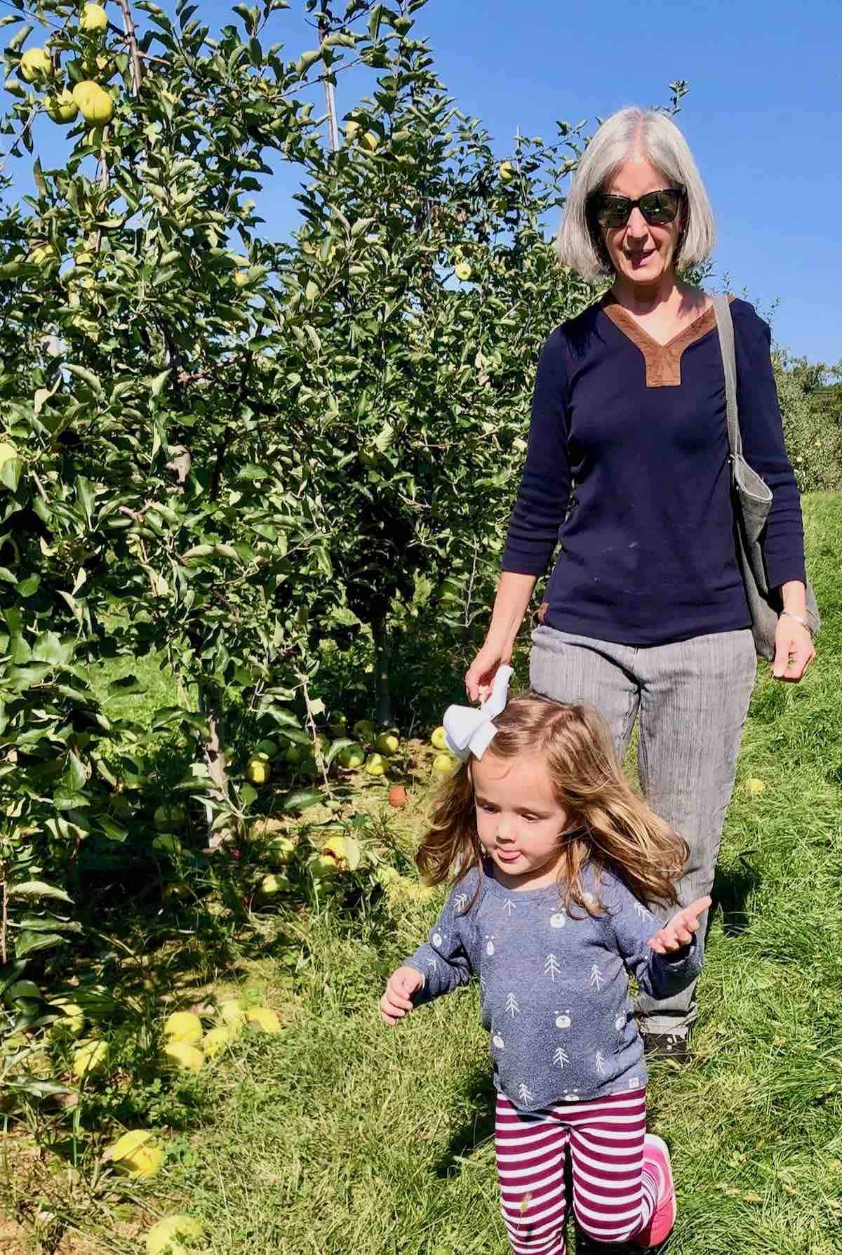 Me and my grand daughter in apple orchard.