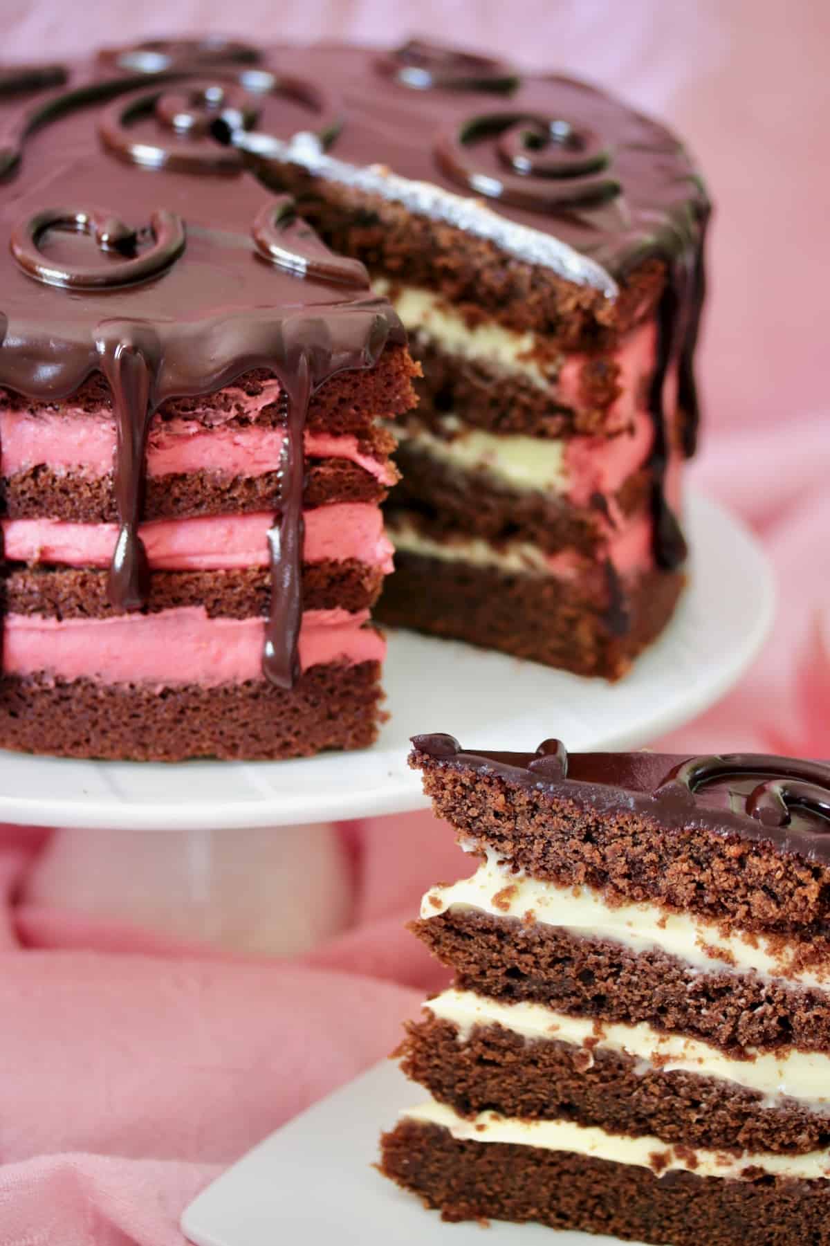 slice of chocolate drip layer cake