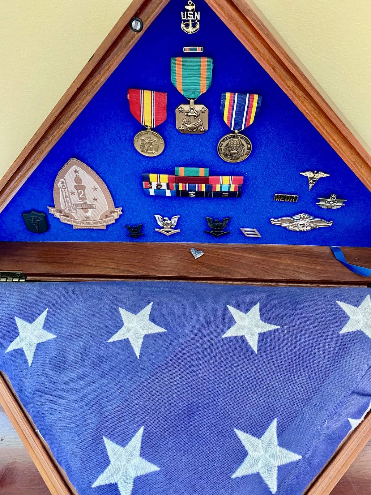Ten years memorial flag and medals remain on display