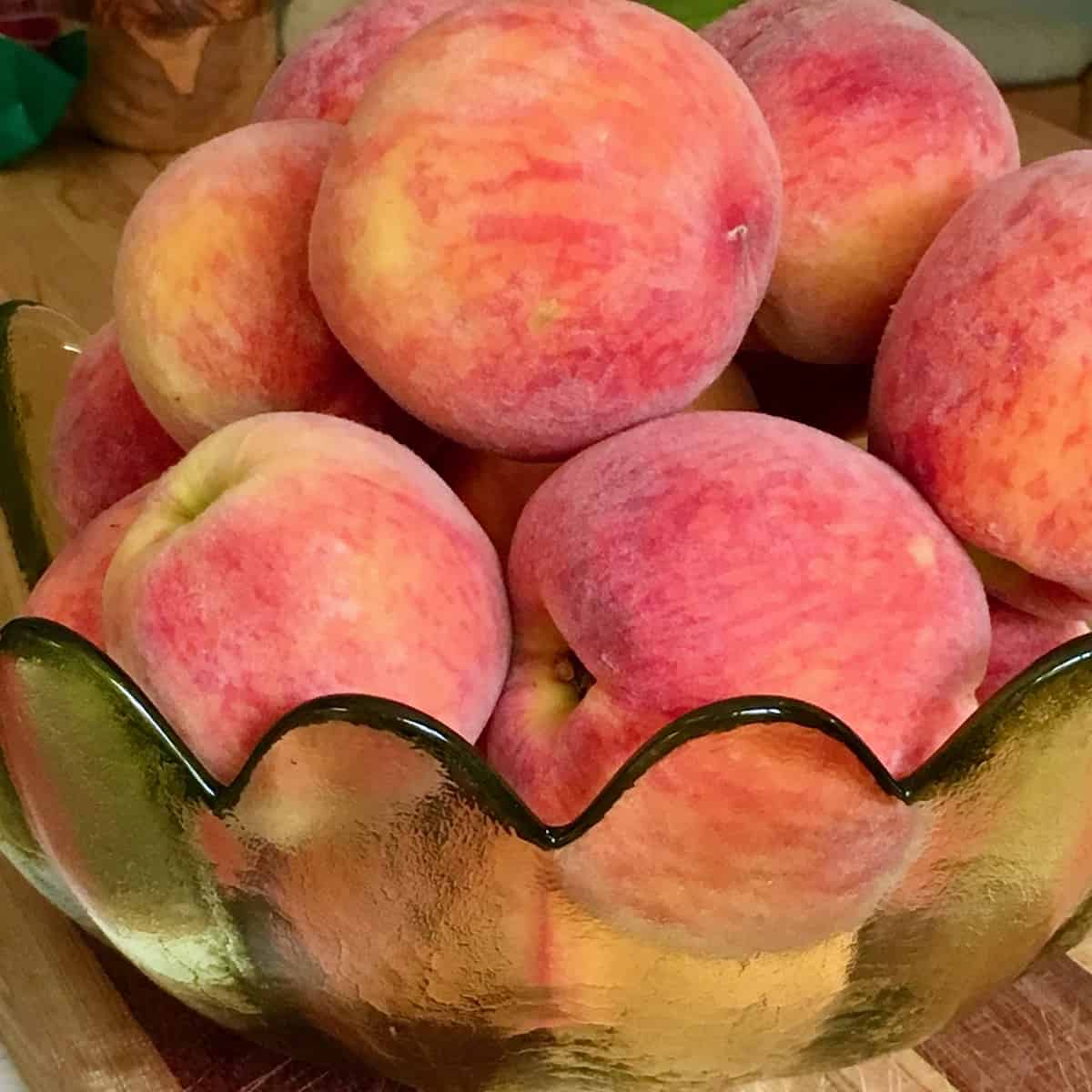 fresh peaches in a bowl for rose petal peach tart